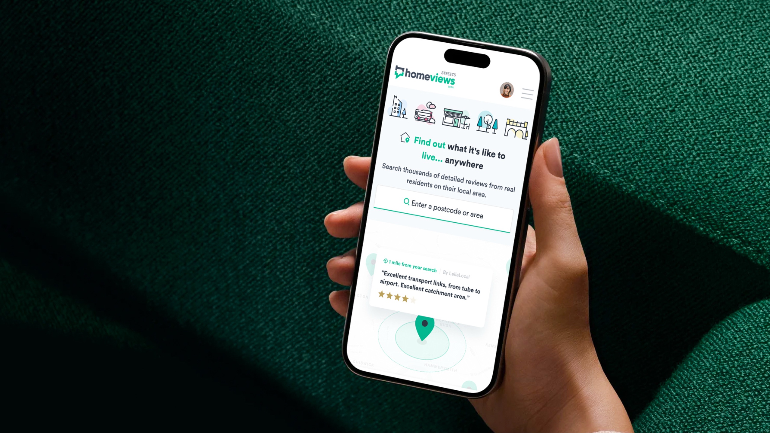 An hand holding a mobile device showing HomeViews Streets progressive web app