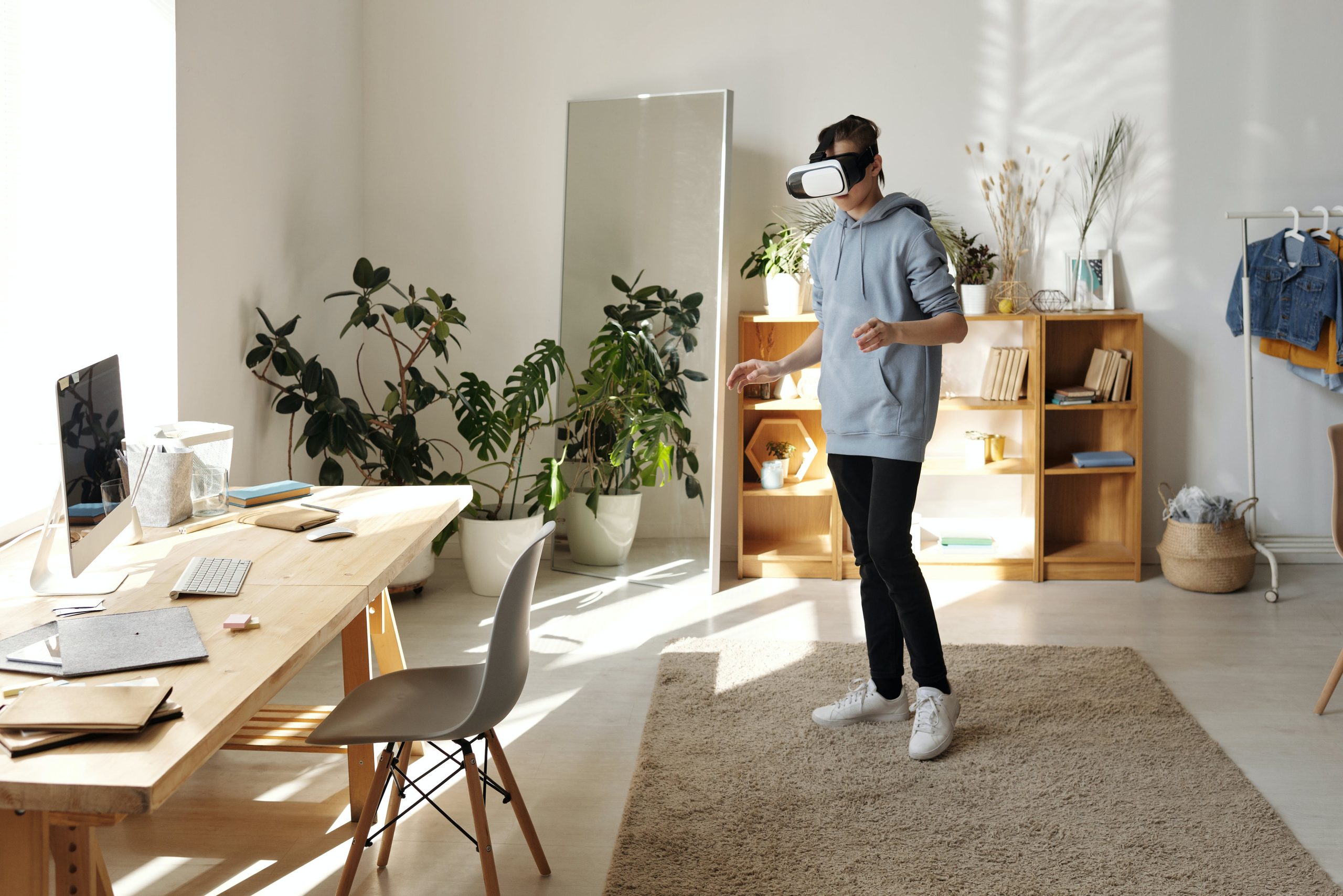 A picture of someone using a VR headset in a home office